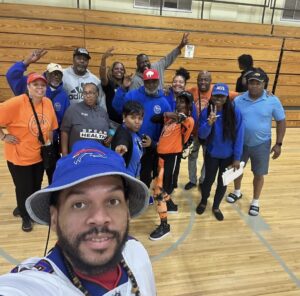 Volunteers and staff posing for picture at Neal Dobbins Inner City Basketball League 