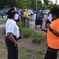 MVP team member speaking with a police officer at an event